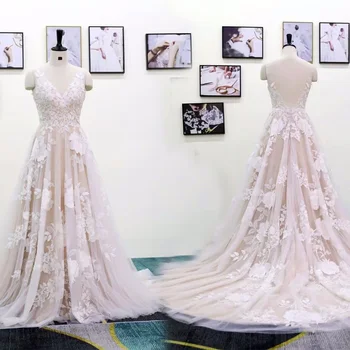Új egyedi pezsgős esküvői ruhák A vonalas V-nyakú földig érő seprővonat rátétes tüll hosszú hát nélküli menyasszonyi ruhák
